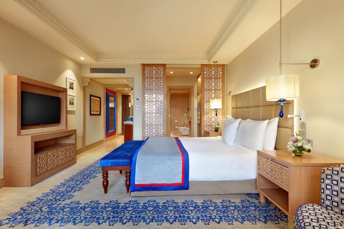 a hotel room with a bed and a television at ITC Maratha, a Luxury Collection Hotel, Mumbai in Mumbai