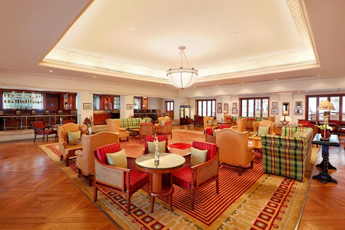 a dining room with a table and chairs at ITC Maratha, a Luxury Collection Hotel, Mumbai in Mumbai