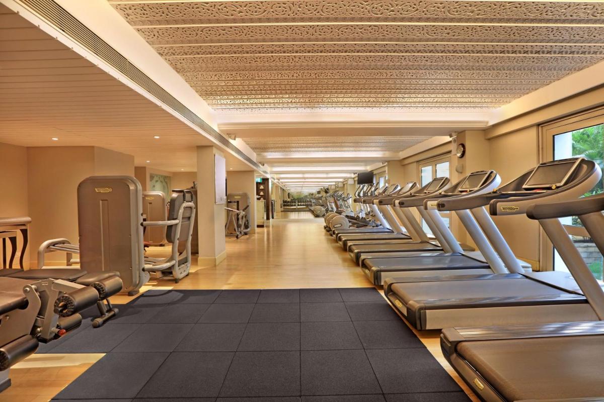 a gym with a row of treadmills at ITC Maratha, a Luxury Collection Hotel, Mumbai in Mumbai