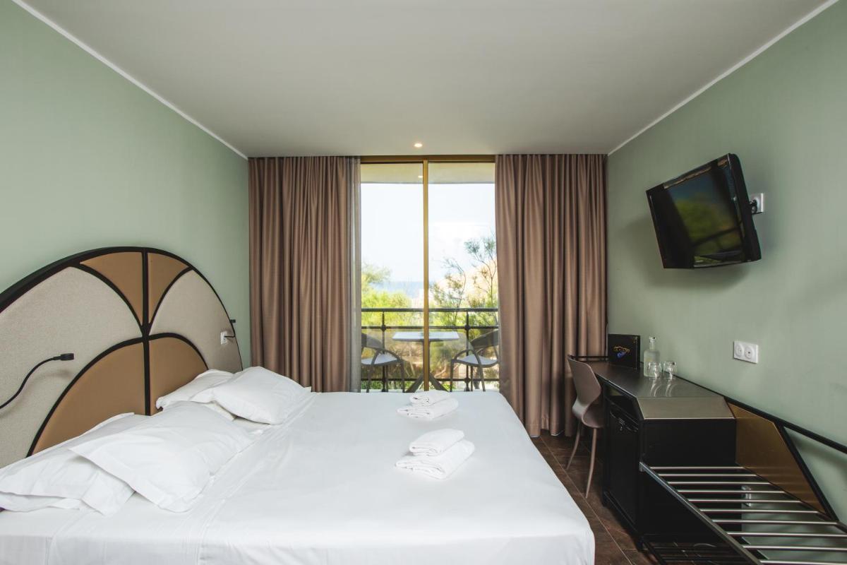 Un ou plusieurs lits dans un hébergement de l'établissement Hotel La Pietra Restaurant & Spa