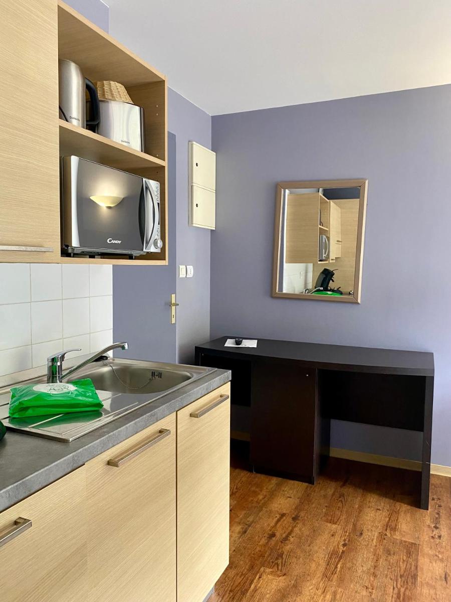 Cuisine ou kitchenette dans l'établissement Résidence Le Grand Tétras- SPA THERMAL INCLUS