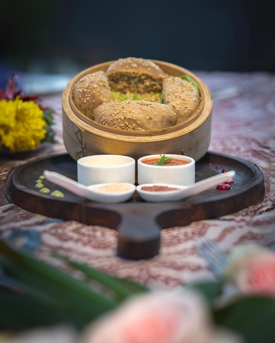 a table with a plate of food on a table at WelcomHeritage Elysium Resort & Spa in Shimla
