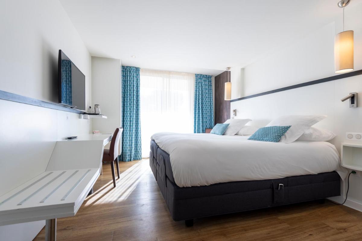 Un ou plusieurs lits dans un hébergement de l'établissement Côté Thalasso Hôtel & Spa Marin