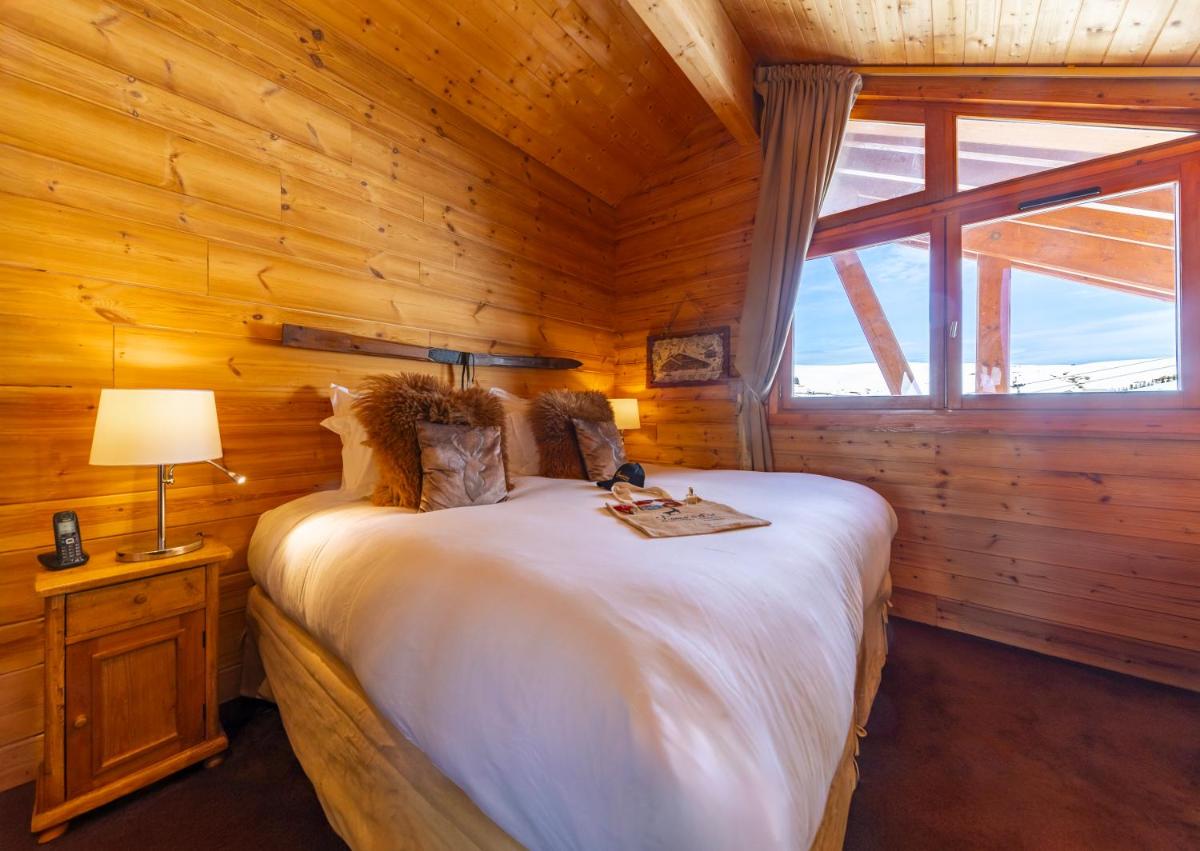 Un ou plusieurs lits dans un hébergement de l'établissement Hôtel Au Chamois d'Or by Les Etincelles