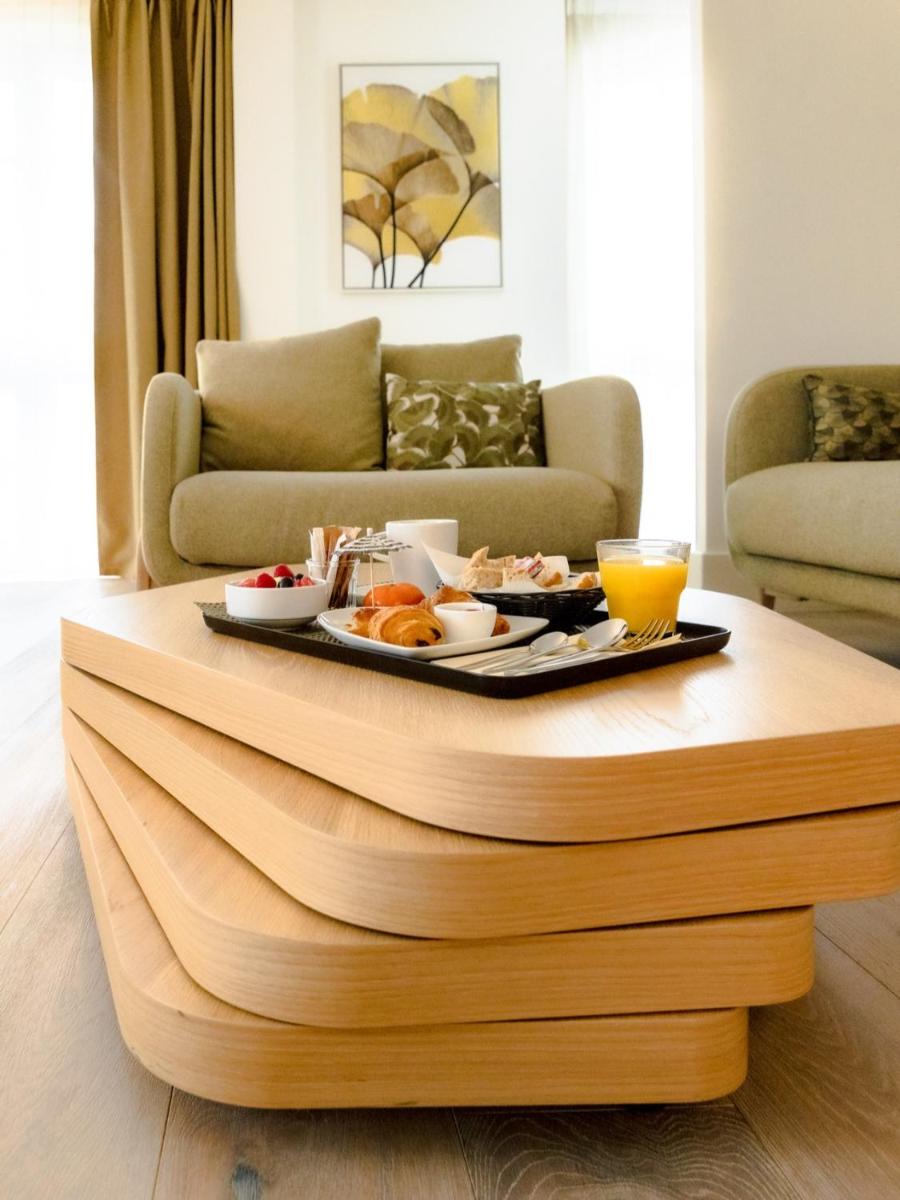 Coin salon dans l'établissement Hôtel Ginkgo - SPA Biloba