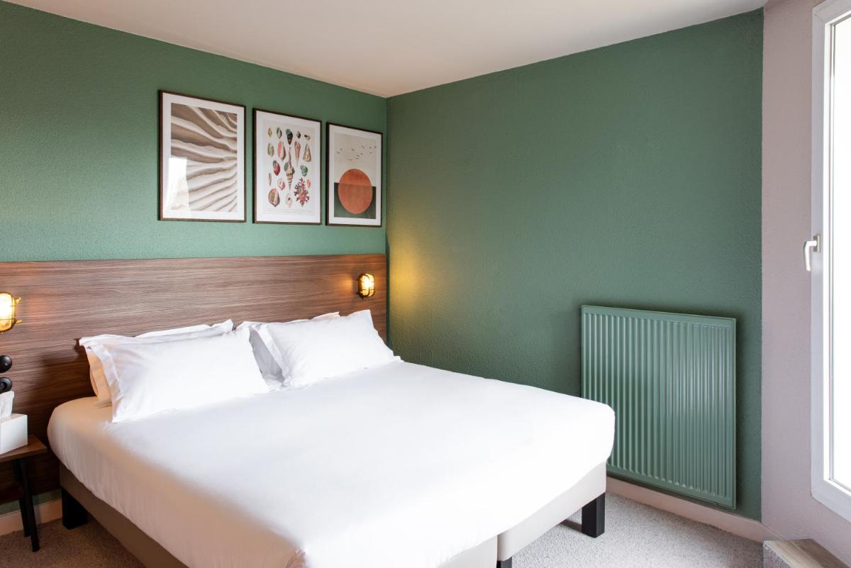 Un ou plusieurs lits dans un hébergement de l'établissement La Maison OBONO Hôtel & Spa