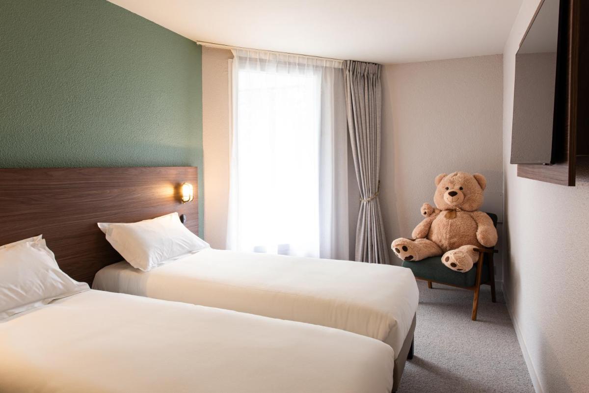Un ou plusieurs lits dans un hébergement de l'établissement La Maison OBONO Hôtel & Spa