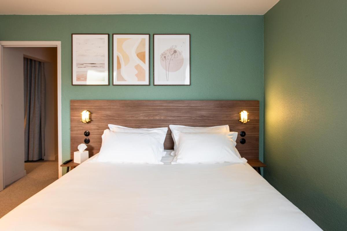 Un ou plusieurs lits dans un hébergement de l'établissement La Maison OBONO Hôtel & Spa
