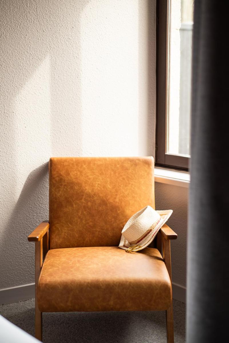 Coin salon dans l'établissement La Maison OBONO Hôtel & Spa