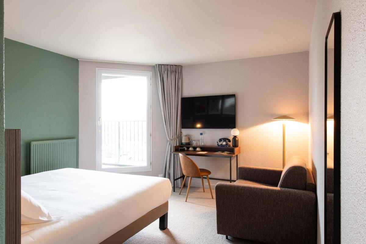 Télévision ou salle de divertissement dans l'établissement La Maison OBONO Hôtel & Spa