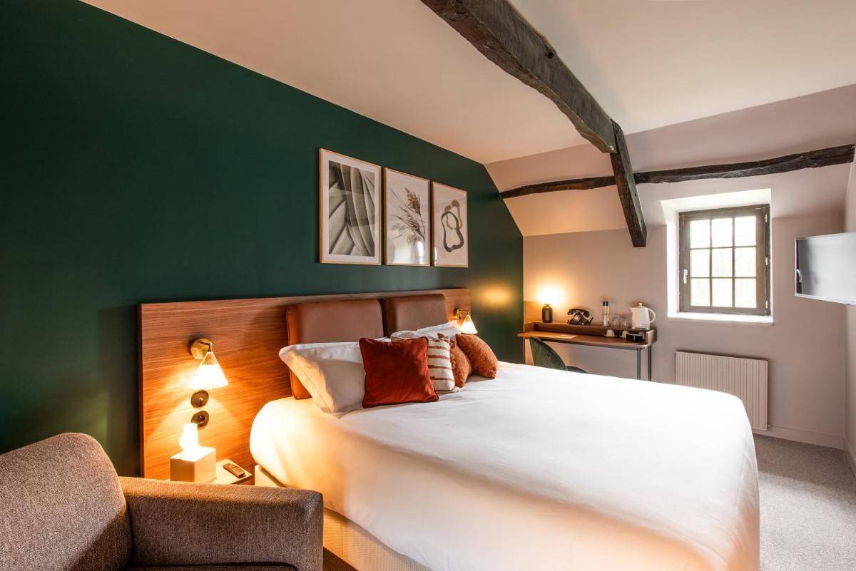 Un ou plusieurs lits dans un hébergement de l'établissement La Maison OBONO Hôtel & Spa
