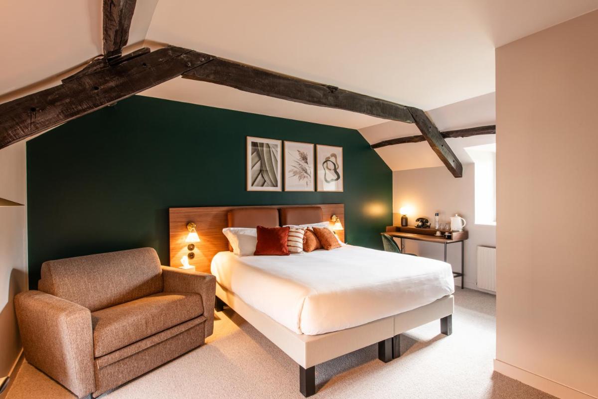 Un ou plusieurs lits dans un hébergement de l'établissement La Maison OBONO Hôtel & Spa