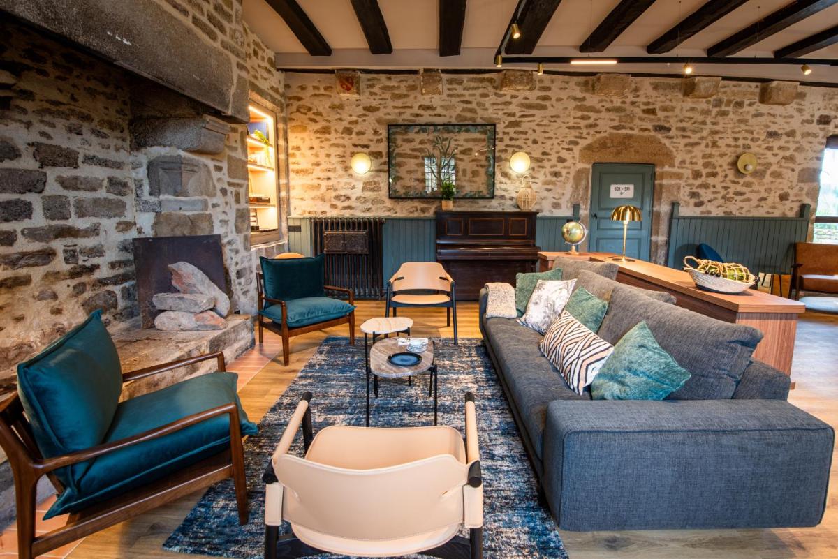 Coin salon dans l'établissement La Maison OBONO Hôtel & Spa