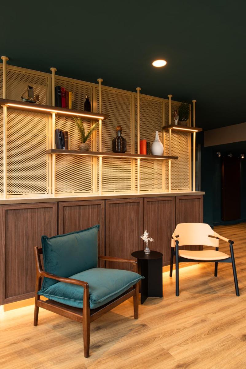 Coin salon dans l'établissement La Maison OBONO Hôtel & Spa
