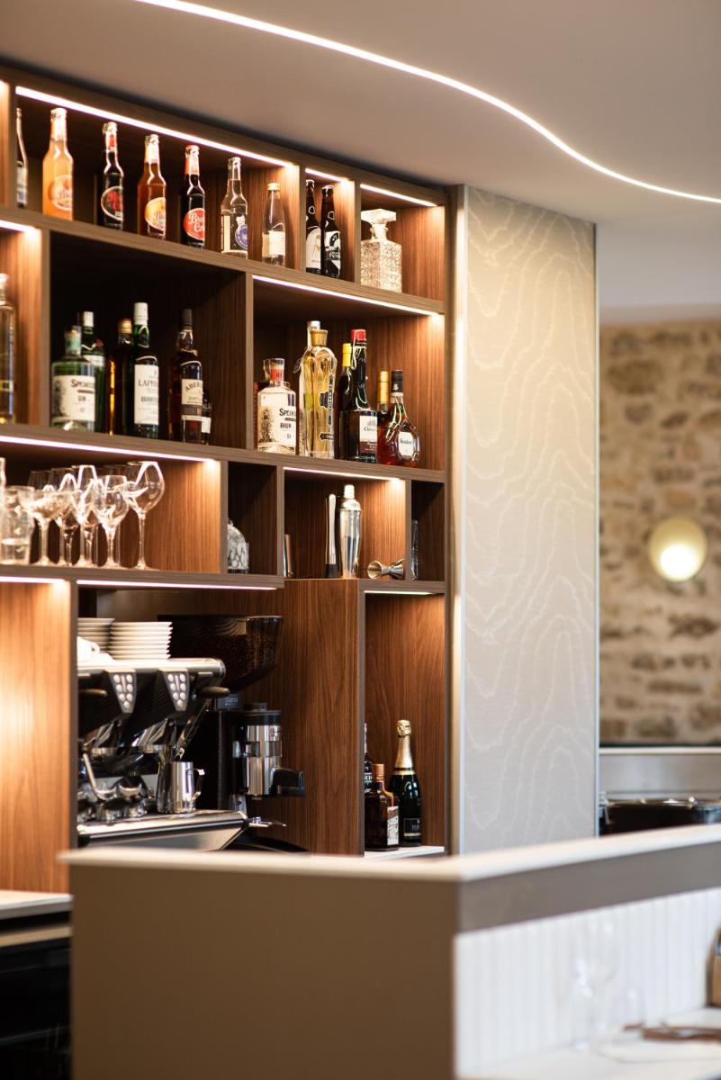 Cuisine ou kitchenette dans l'établissement La Maison OBONO Hôtel & Spa