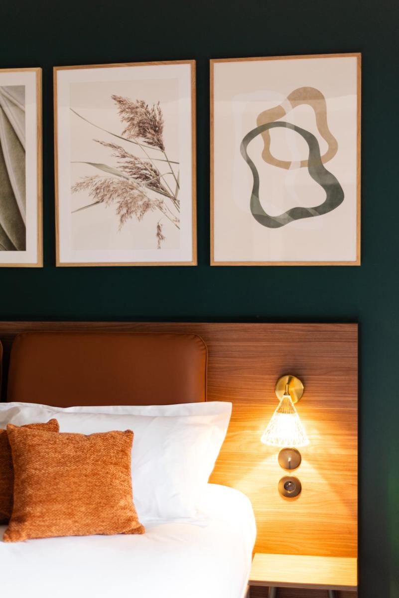 Un ou plusieurs lits dans un hébergement de l'établissement La Maison OBONO Hôtel & Spa