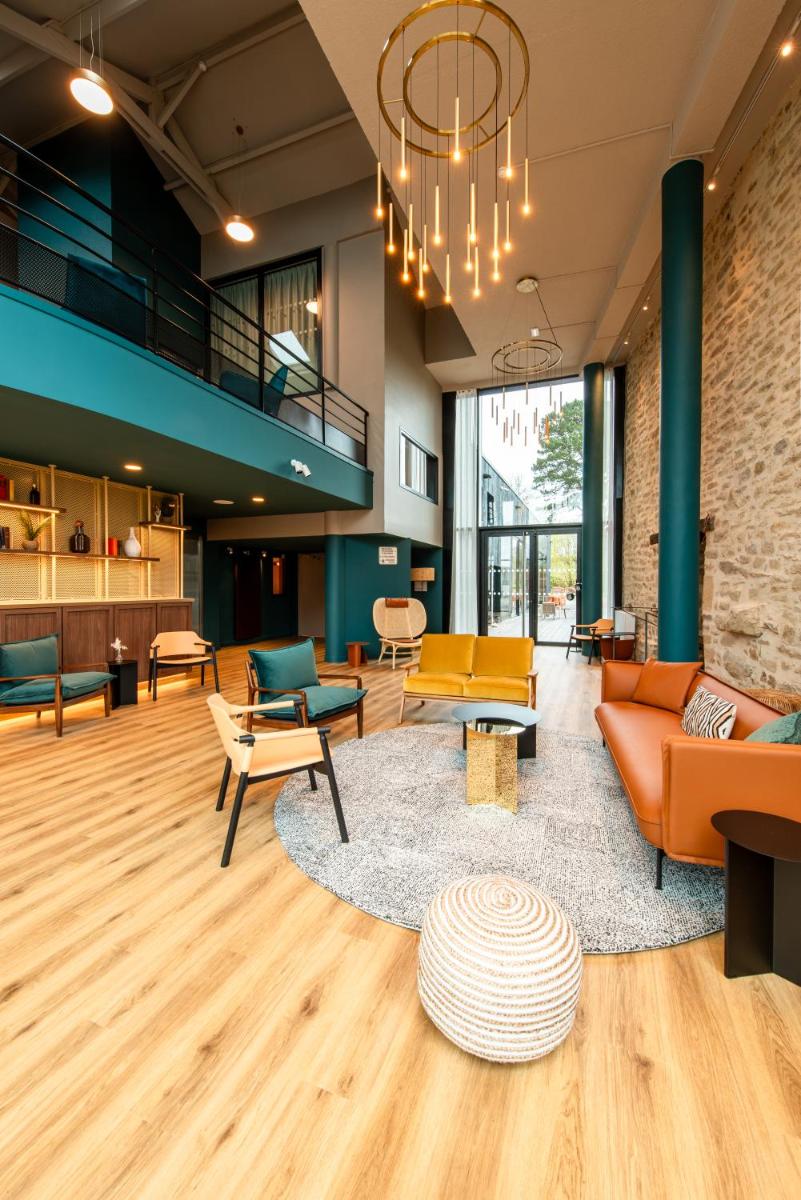 Coin salon dans l'établissement La Maison OBONO Hôtel & Spa