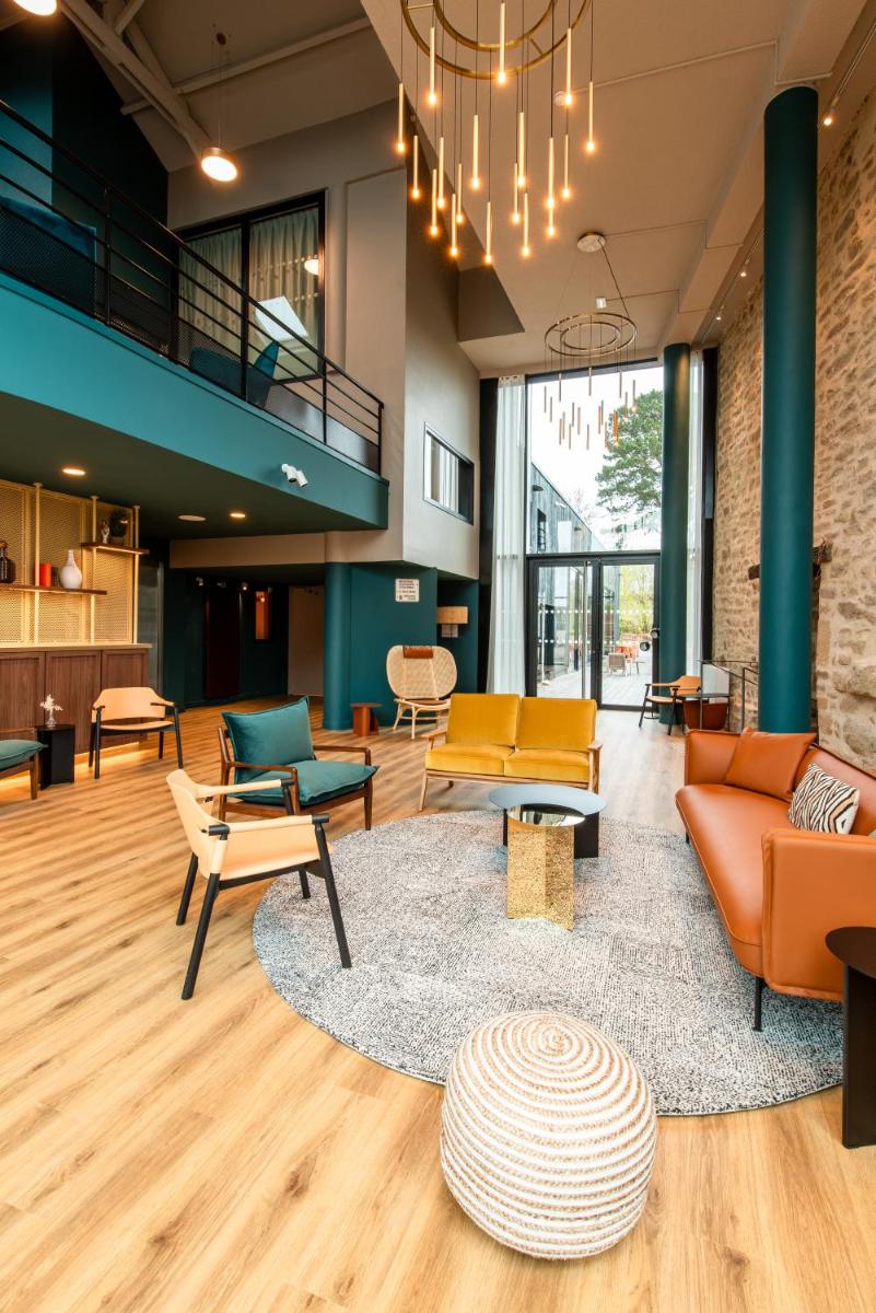 Coin salon dans l'établissement La Maison OBONO Hôtel & Spa