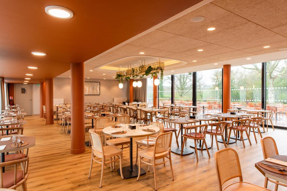 Restaurant ou autre lieu de restauration dans l'établissement La Maison OBONO Hôtel & Spa