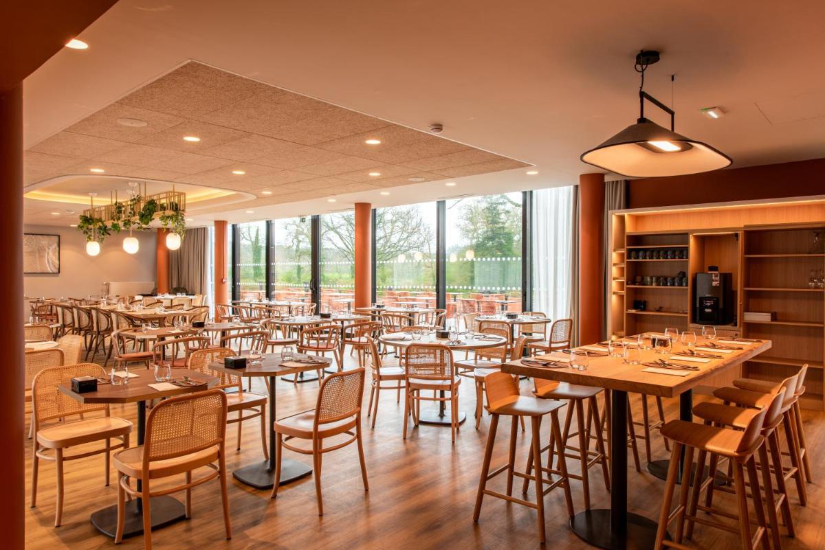 Restaurant ou autre lieu de restauration dans l'établissement La Maison OBONO Hôtel & Spa