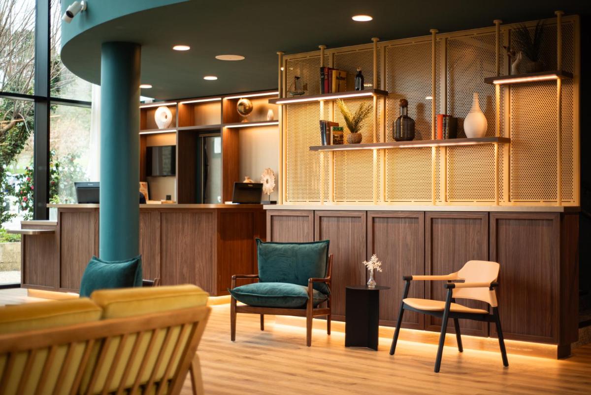 Coin salon dans l'établissement La Maison OBONO Hôtel & Spa