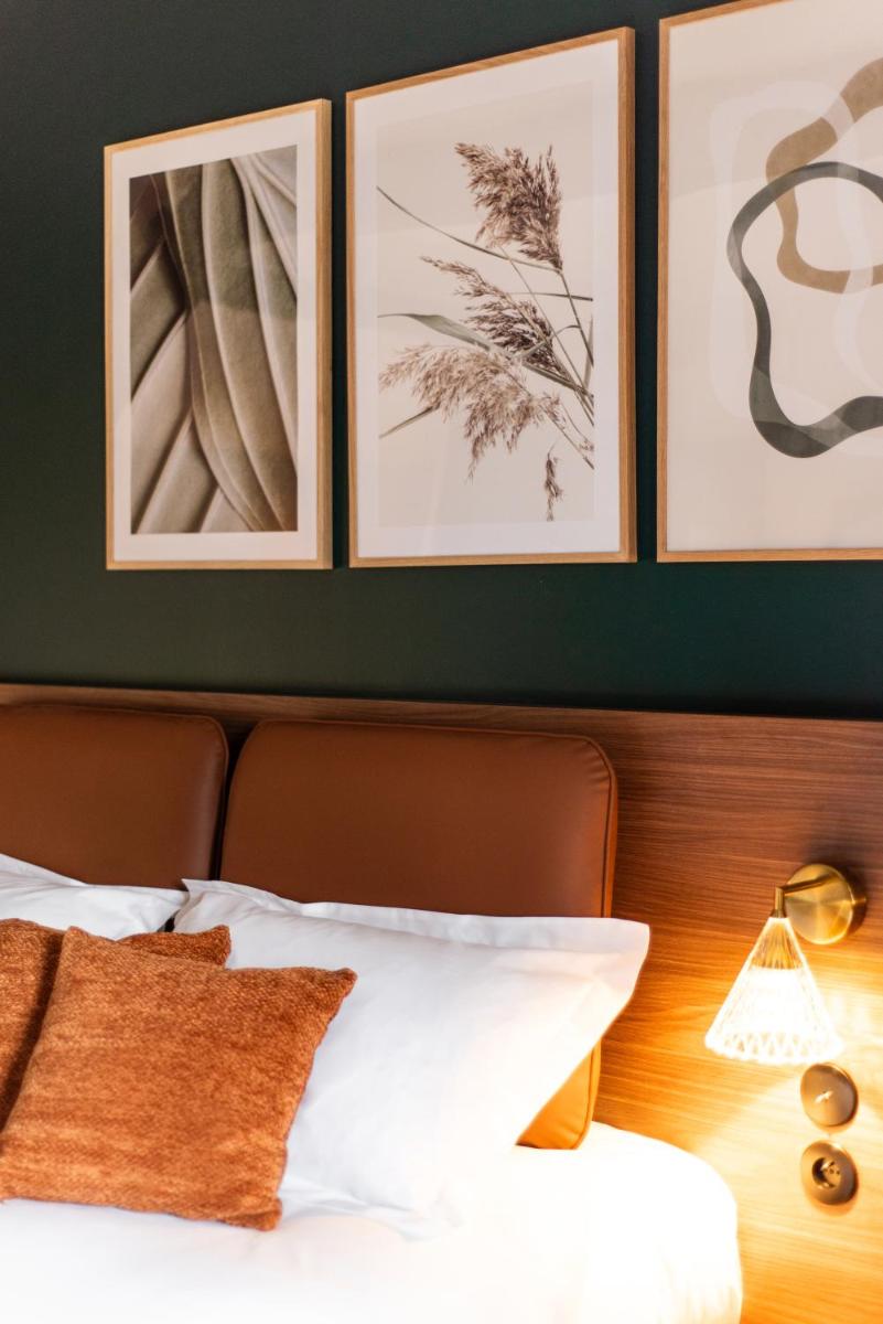 Un ou plusieurs lits dans un hébergement de l'établissement La Maison OBONO Hôtel & Spa