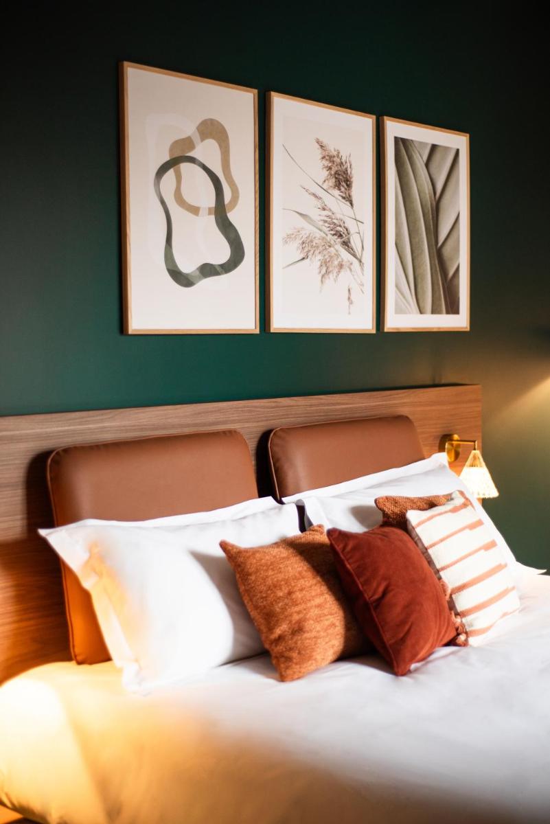 Un ou plusieurs lits dans un hébergement de l'établissement La Maison OBONO Hôtel & Spa
