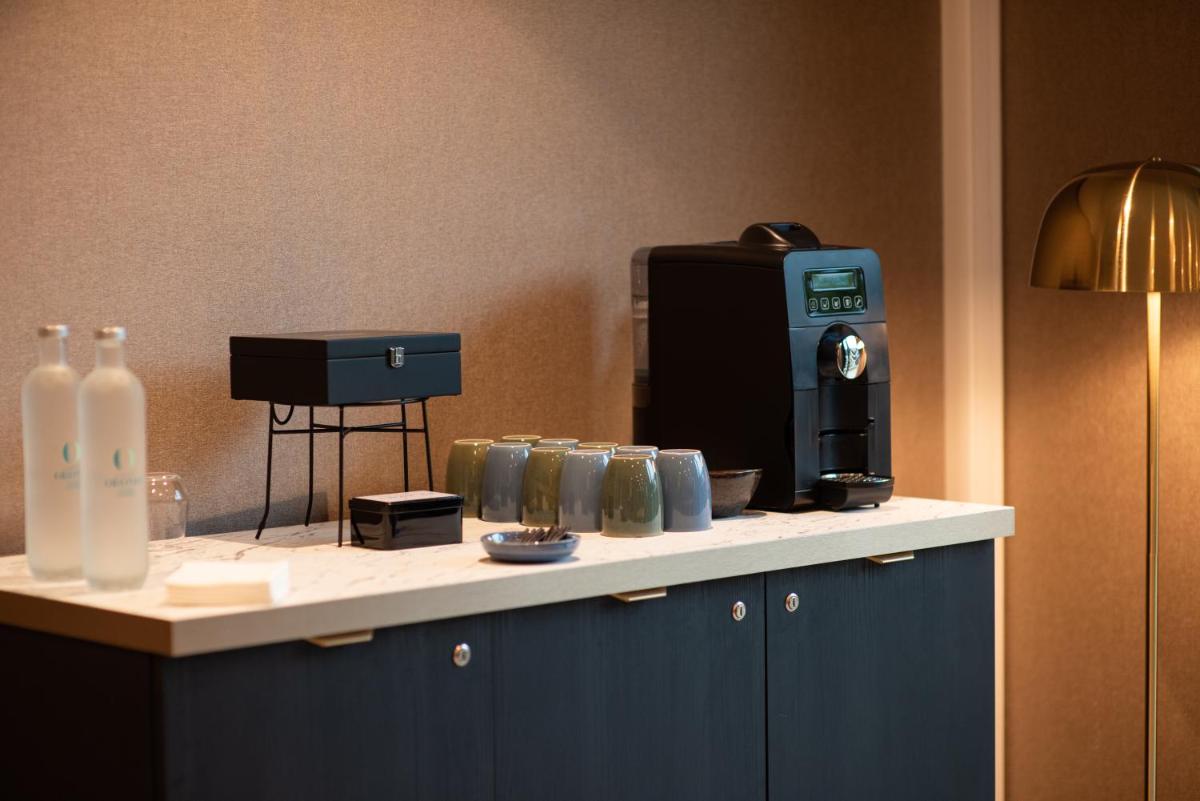 Cuisine ou kitchenette dans l'établissement La Maison OBONO Hôtel & Spa