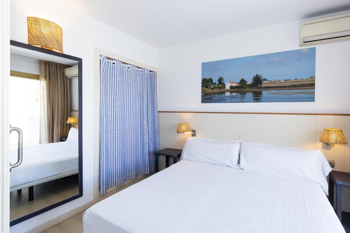 Cama o camas de una habitación en Blaumar Hotel