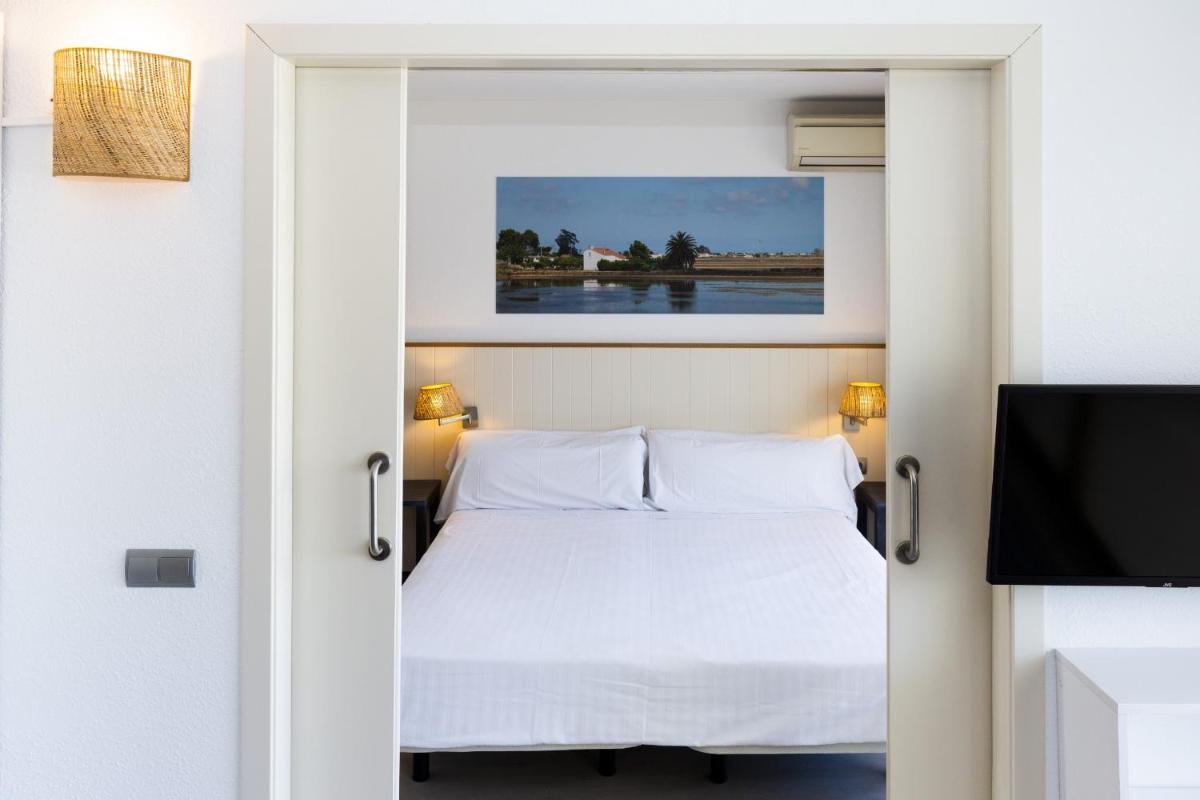 Cama o camas de una habitación en Blaumar Hotel