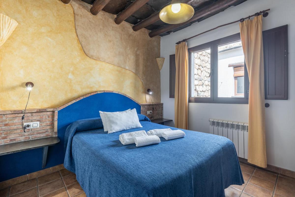 Cama o camas de una habitación en Turismo Rural & SPA El Cercado