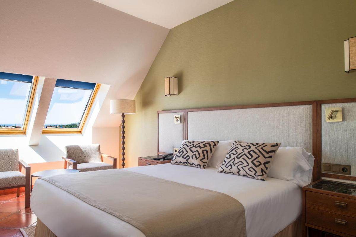 Cama o camas de una habitación en Puerto Antilla Grand Hotel