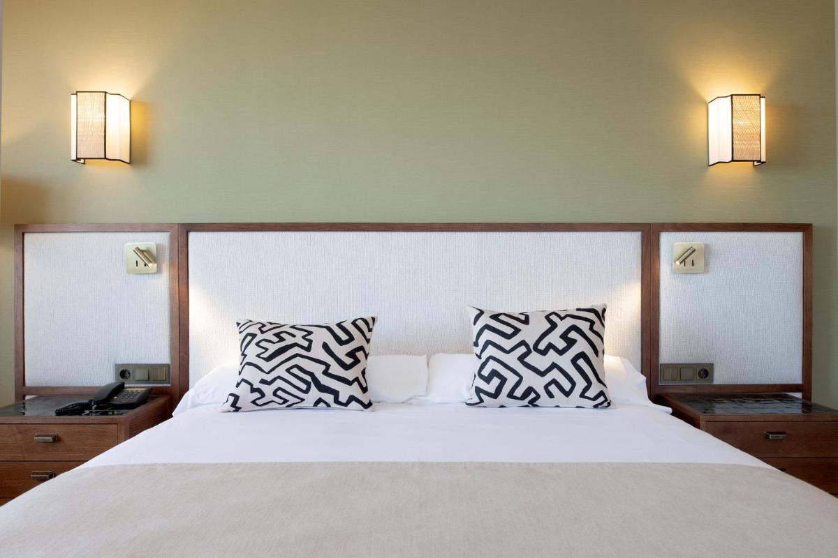 Cama o camas de una habitación en Puerto Antilla Grand Hotel