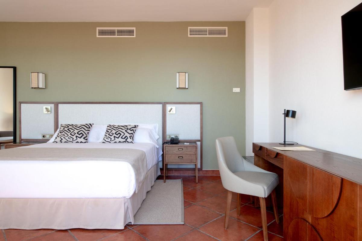 Cama o camas de una habitación en Puerto Antilla Grand Hotel