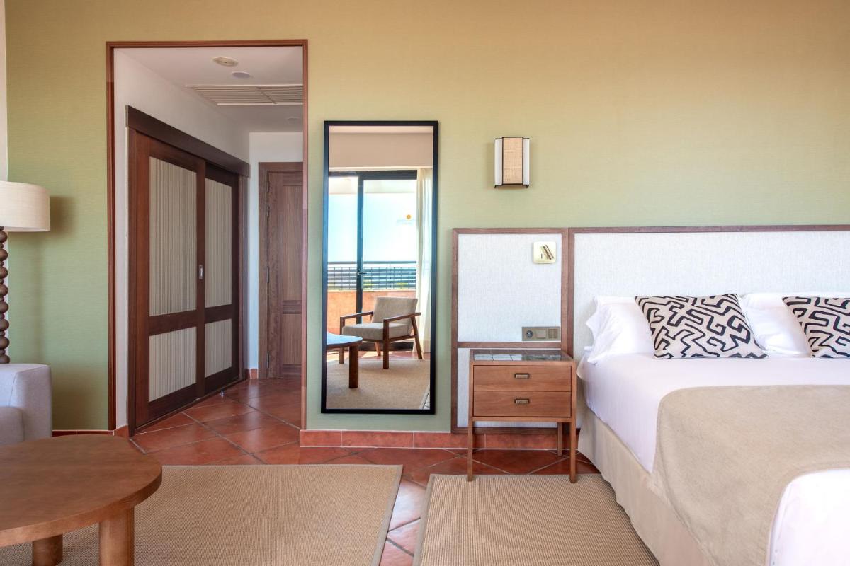 Cama o camas de una habitación en Puerto Antilla Grand Hotel