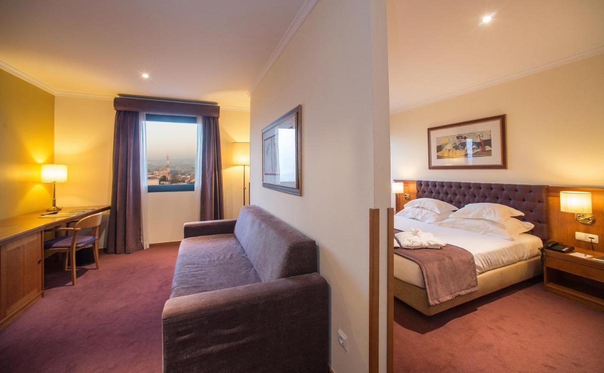 Uma cama ou camas num quarto em Vila Gale Porto - Centro