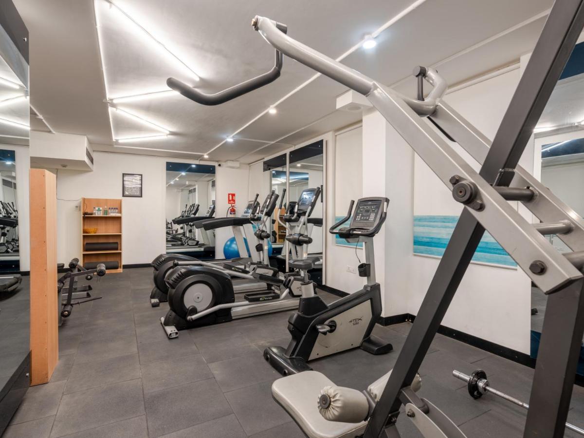 a gym with treadmills and elliptical machines at Sunday Hotel Chandigarh Zirakpur in Zirakpur