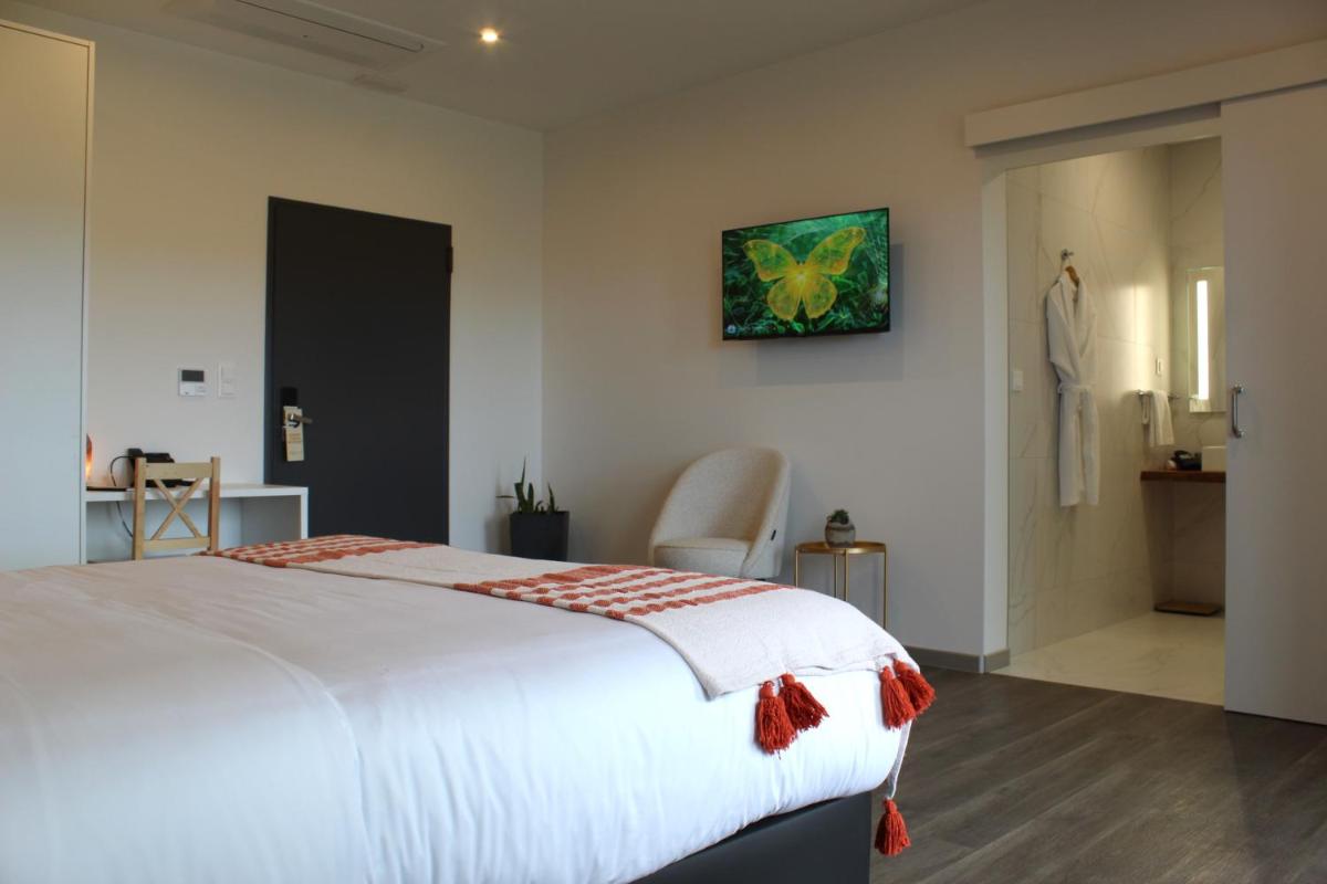 Uma cama ou camas num quarto em Xhale Azores