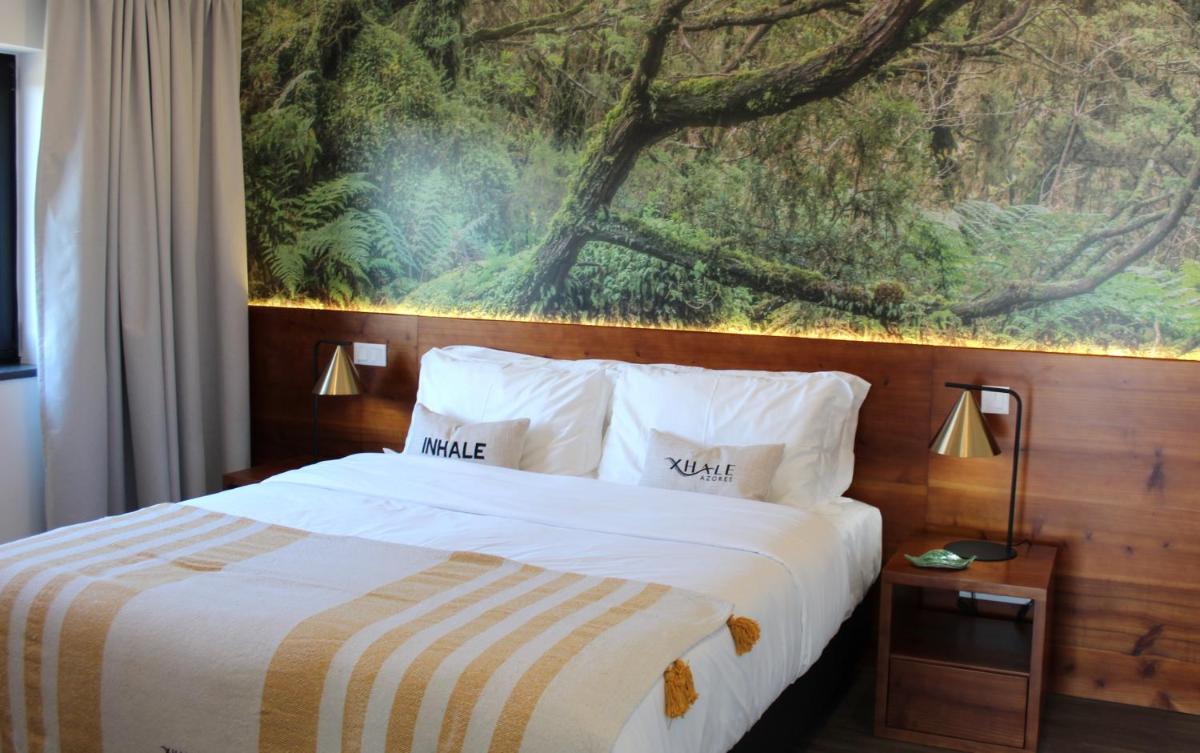 Uma cama ou camas num quarto em Xhale Azores