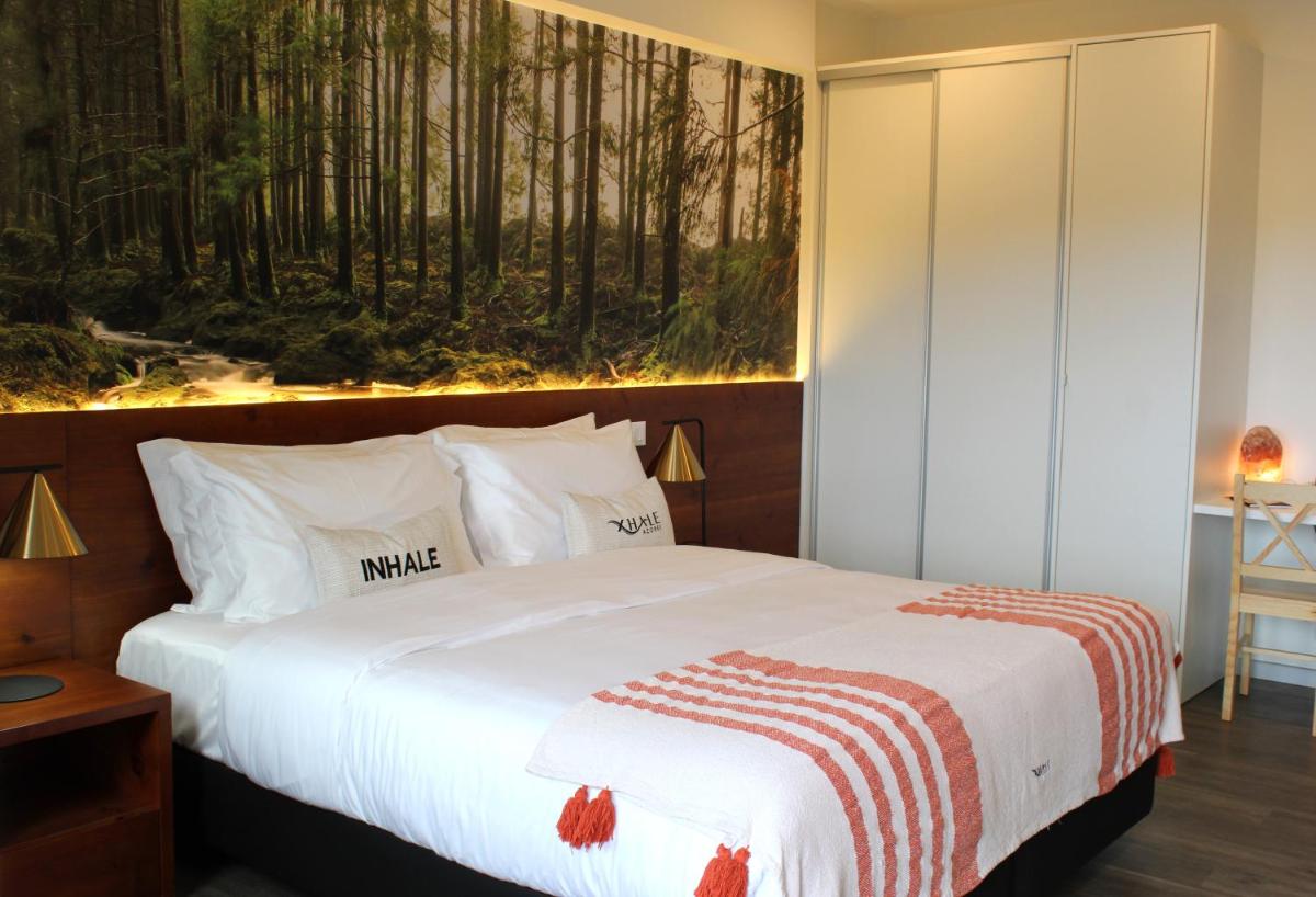 Uma cama ou camas num quarto em Xhale Azores