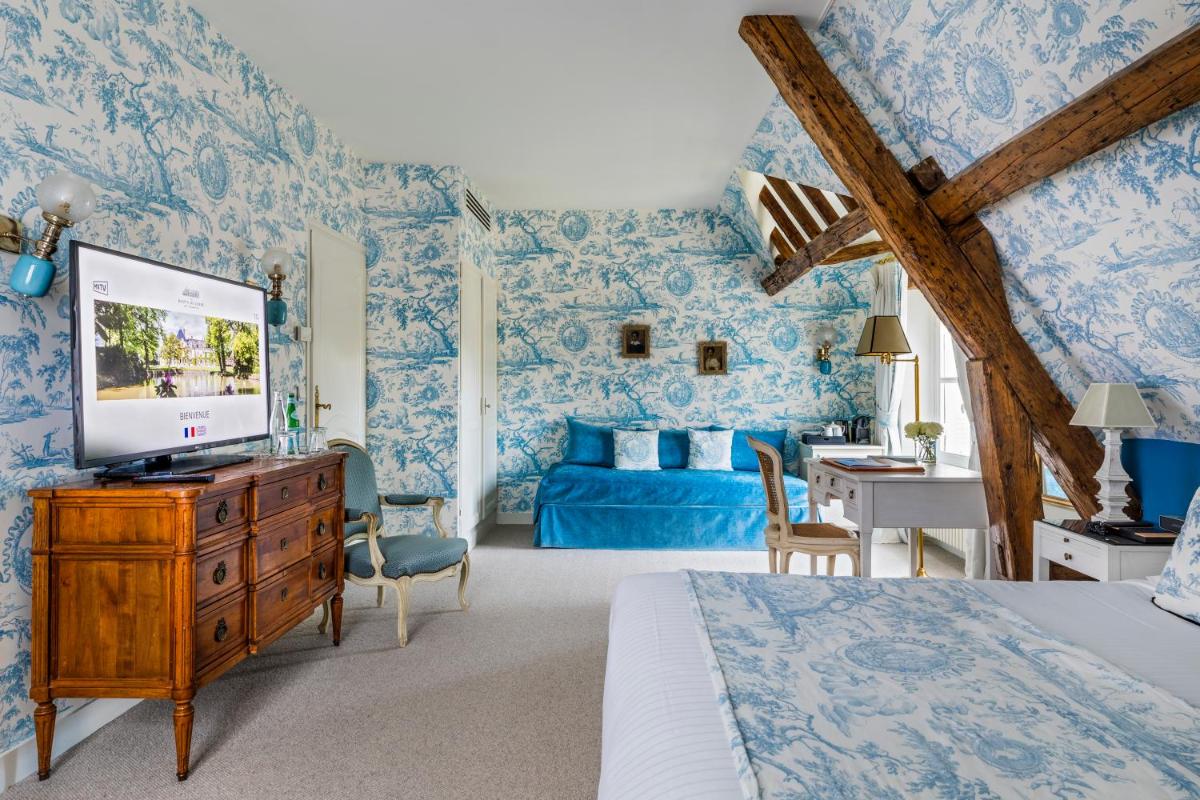 Télévision ou salle de divertissement dans l'établissement Les Hauts de Loire Relais & Châteaux