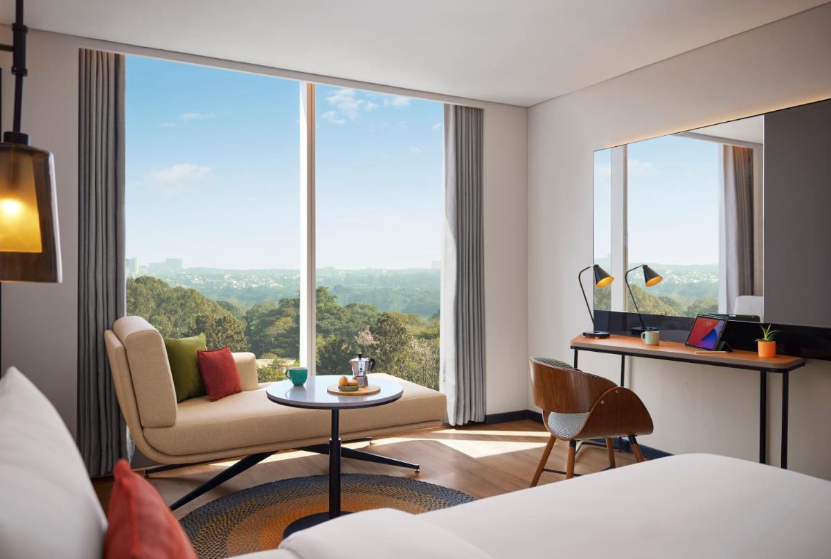 a hotel room with a view of a room at Hyatt Centric Hebbal Bengaluru in Bengaluru