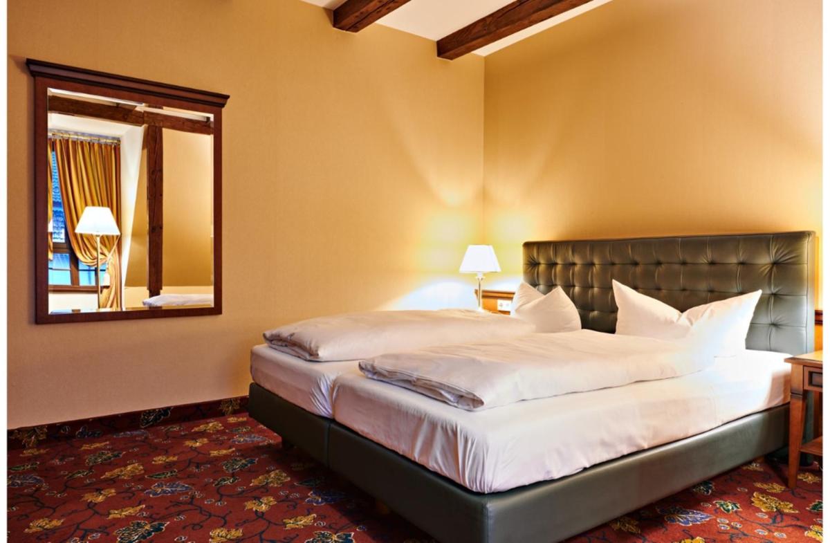 Ein Bett oder Betten in einem Zimmer der Unterkunft Bernsteinschloss