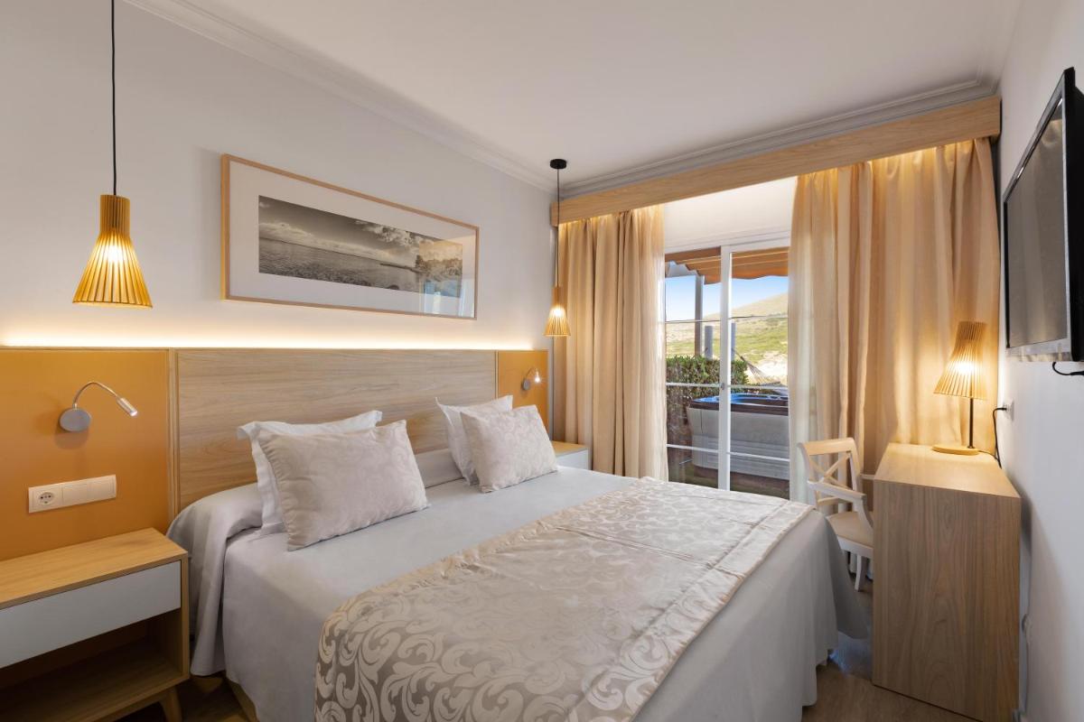 Cama o camas de una habitación en VIVA Cala Mesquida Resort & Spa