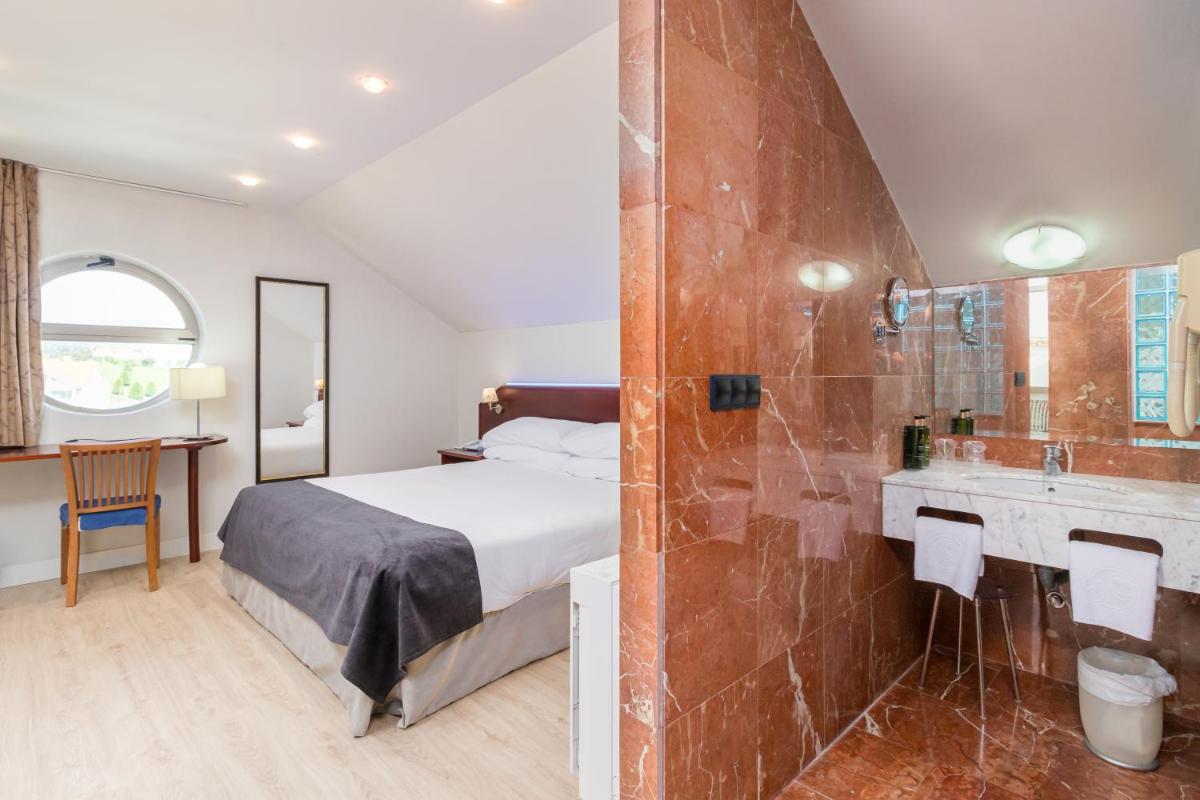 Cama o camas de una habitación en Hotel Milagros Golf