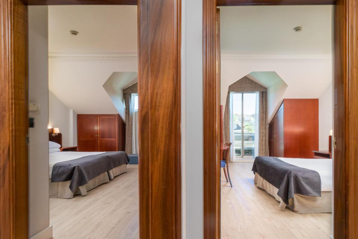 Cama o camas de una habitación en Hotel Milagros Golf
