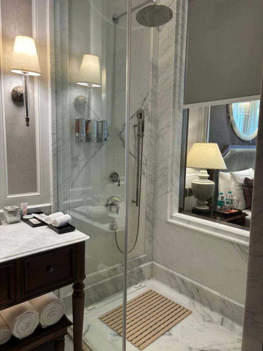 a bathroom with a shower with a glass door at Welcomhotel by ITC Hotels, The Savoy, Mussoorie in Mussoorie