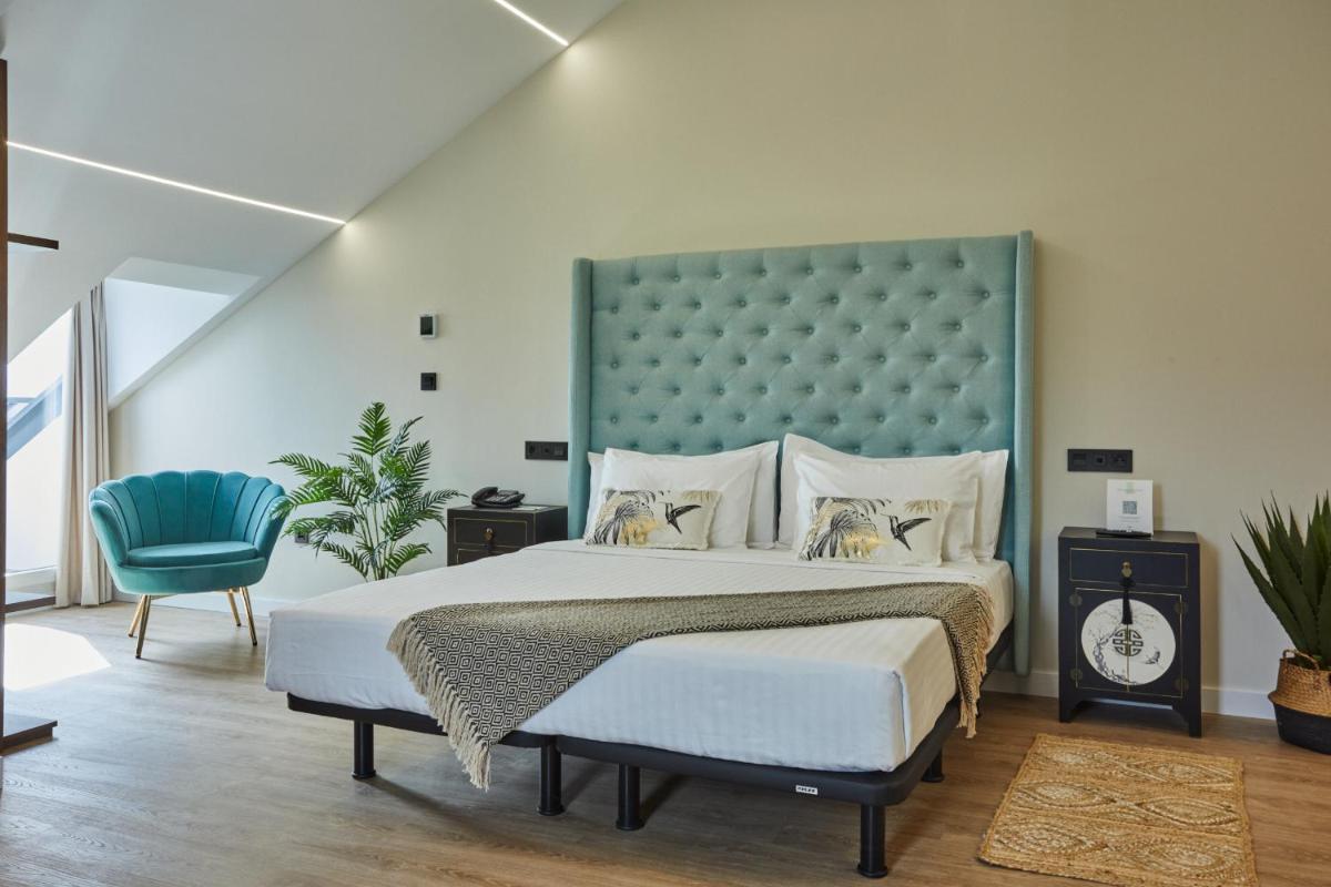 Cama o camas de una habitación en Apartamentos Silken Fontibre Iberia & Spa