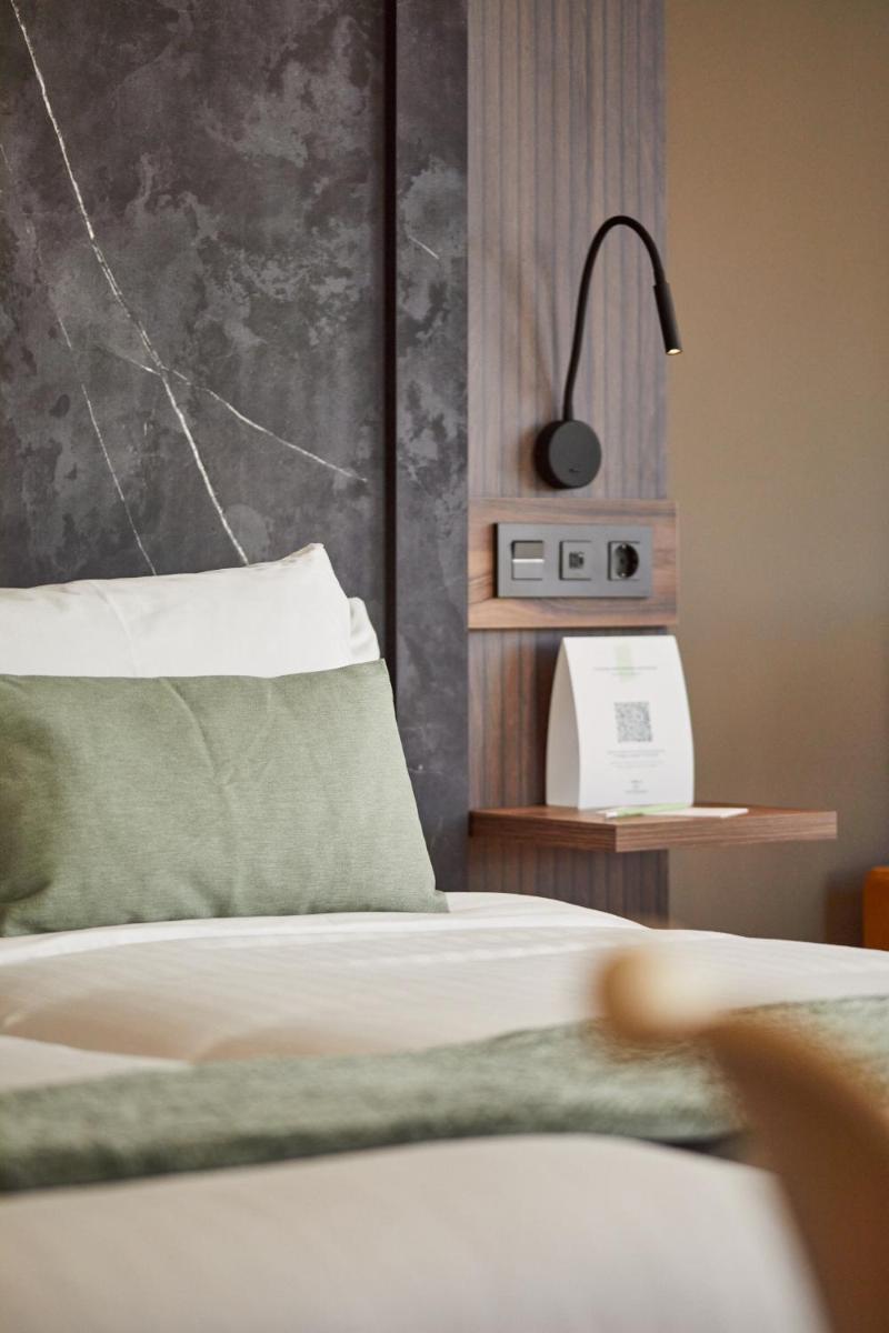 Cama o camas de una habitación en Apartamentos Silken Fontibre Iberia & Spa