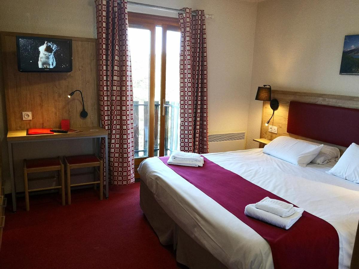 Un ou plusieurs lits dans un hébergement de l'établissement Hôtel Espace Montclar